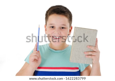 Portrait of Handsome Teen Boy Student hold Book and Pencil pointing  gestured idea or doing number one gesture. Isolated on white background. Back to School concept. Learning Concept.