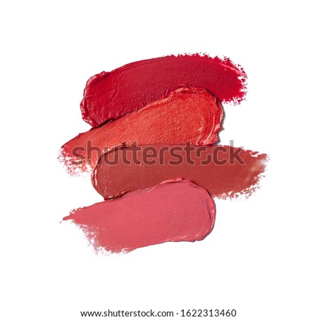 Collection of smudged lipsticks isolated on white