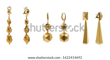 Women gold drop earrings, dangle style set of three pair. High end jewelry made from clean plain gold without ornaments. Royalty-Free Stock Photo #1622414692