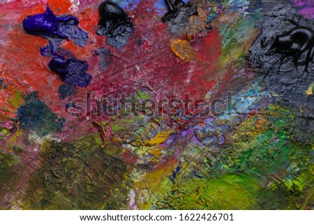 Multicolor palette with bright paints, close up