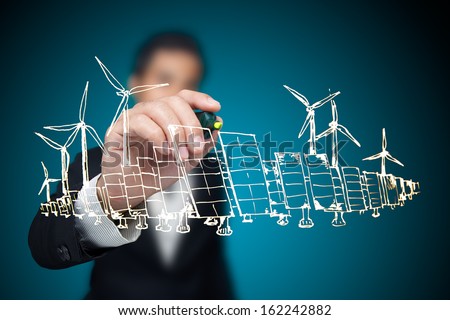 Businessman drawing renewable energy project. Royalty-Free Stock Photo #162242882