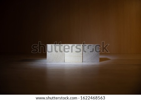 Tower of four wooden cubes, isolated on white background