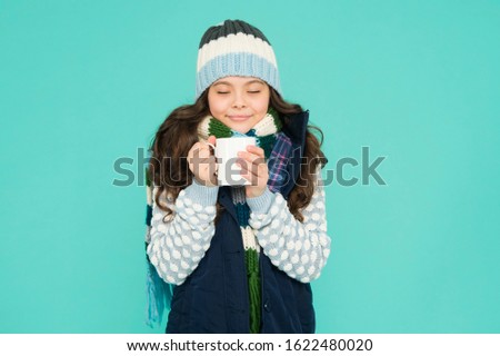 Hot chocolate recipe. Dessert concept. Coffee break. Hot beverage. Idea for warming. Happy girl hipster. Kid winter fashion. Child warm knitwear. Baby tea cup. Have warming drink. Drinking hot cocoa.