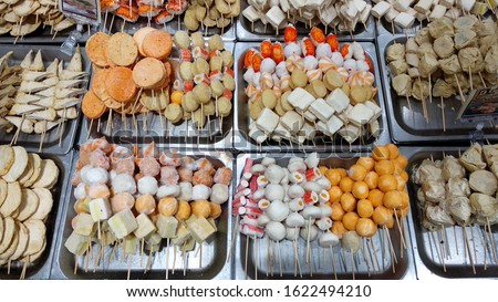 Variety of frozen Kamaboko or Japanese fish cake in bamboo sticks. Usually served in oden (boiled in stock) or fried.