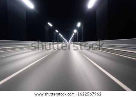 The motion blurred road surface of the bridge photographed on the driving car Royalty-Free Stock Photo #1622567962
