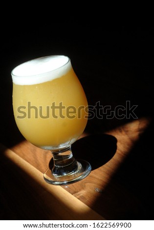 Perfectly Poured Craft Beer in Glass Royalty-Free Stock Photo #1622569900