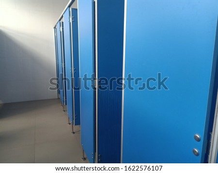 The bathroom background has blue walls and doors.