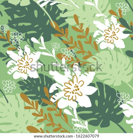 green tropical leaves with white flowers