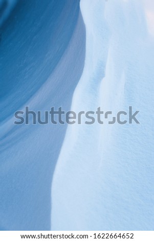 White slope of the snowy mountain, beautiful abstract background. Snowdrift. Winter backdrop concept. Frost winter season
