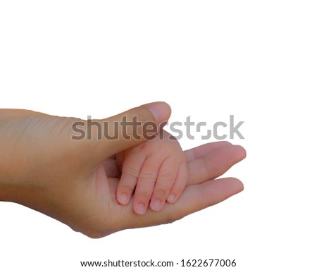 The mother's hand gently holds the baby's hand, isolated on a white background.