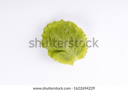 
phased assembly of a hamburger on a white background