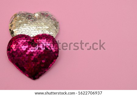 Two hearts on a pink background. Valentine's day composition Royalty-Free Stock Photo #1622706937