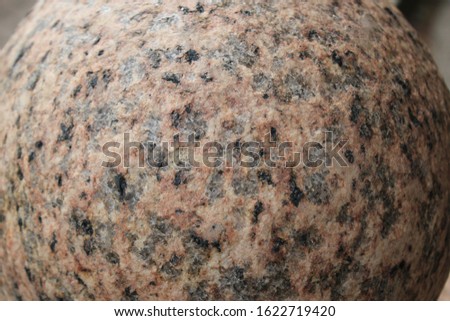 Closeup of a sphere shaped marble stone.