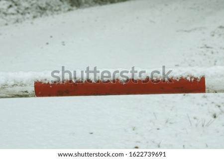 barrier white and red covered with snow
