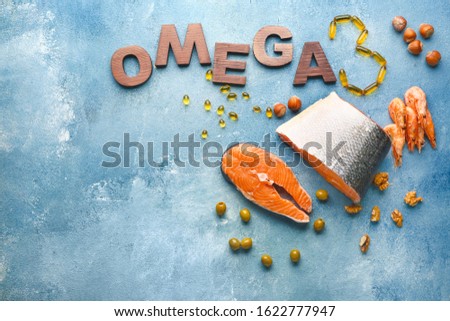 Set of healthy products with high omega 3 and fish oil pills on color background Royalty-Free Stock Photo #1622777947