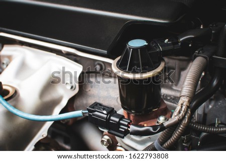 Close up of The old Exhaust gas recirculation in the engine compartment to reduce the carbon monoxide gas from the exhaust. automotive part concept. Royalty-Free Stock Photo #1622793808