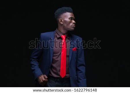Young black man. Portrait successful smiling cheerful african american businessman executive stylish company leader. Isolated on black background.