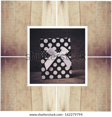 Gift box with bow on wood collage background
