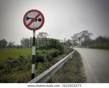 No horn sign at the highway. round silent symbol plate