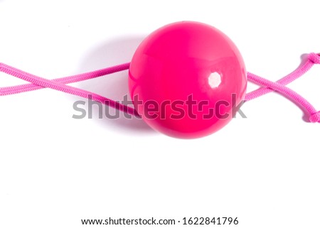 Rhythmic Gymnastic equipment. Pink Skipping Rope and Sasaki ball. Isolated on white background with space for text