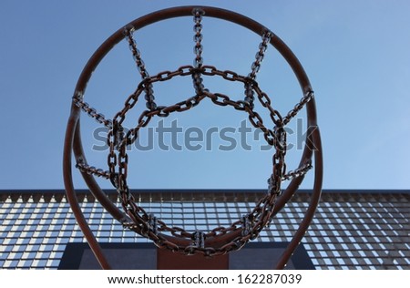 Closeup of a basketball net made of metal Basketball Basketball net and blue sky 