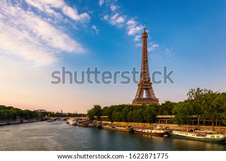 Paris Eiffel Tower and river Seine at sunset in Paris, France. Eiffel Tower is one of the most iconic landmarks of Paris. Eiffel tower in summer, Paris, France. The Eiffel Tower, France. Royalty-Free Stock Photo #1622871775