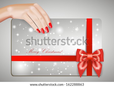 Hand with red manicure and a greeting card