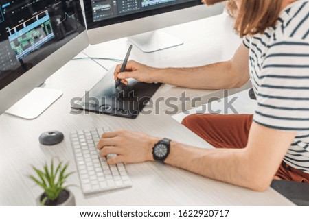 cropped view of editor typing on computer keyboard