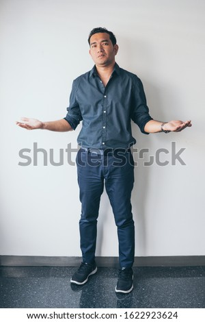 Friendly man with welcoming gesture isolated on white background