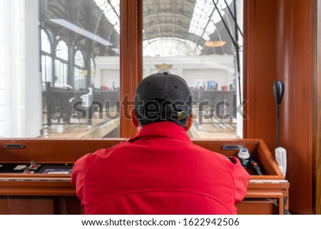 The train driver is driving the train to the platform.