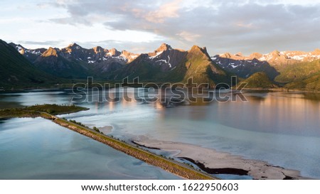 Astonishing aerial views of mountains raising from the fjords in Lofoten Islands, Norway