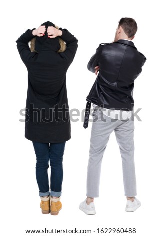 Back view of couple in winter jacket. beautiful friendly girl and guy together. Rear view people collection. backside view of person. Isolated over white background.