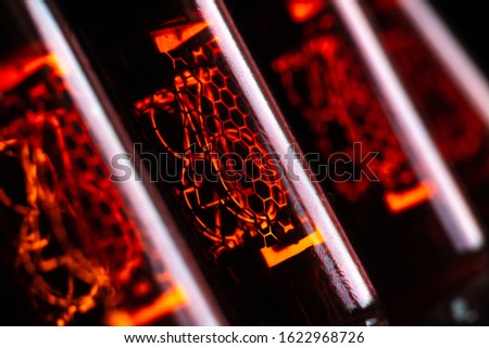 Red nixie tubes, old discharge tubes, steampunk Royalty-Free Stock Photo #1622968726