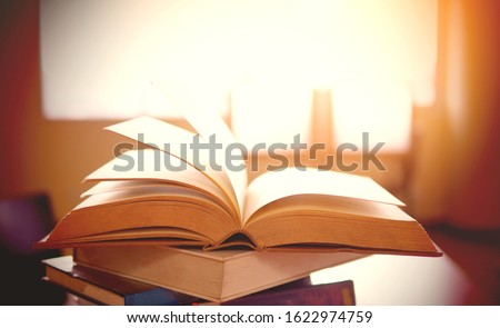 Education conceptual picture, selective focused image of books in pile in a study room or library of school, college, or university campus, academic or scholar related content, school concept