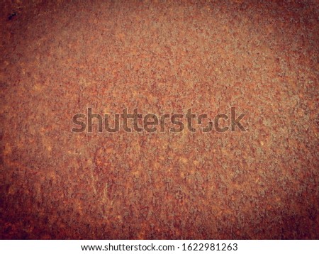 Rusty​ on the​ wall​ metal​ texture for background. The pattern​ of​ grunge​d rust​ on​ the  wall​ use​ for​ background. Red rust​ on the​ surface​ wall​ steel​