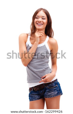girl standing on white background, wearing shorts