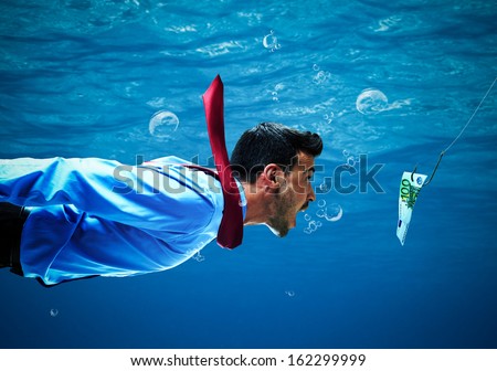 Underwater scene of a businessman taking the bait Royalty-Free Stock Photo #162299999