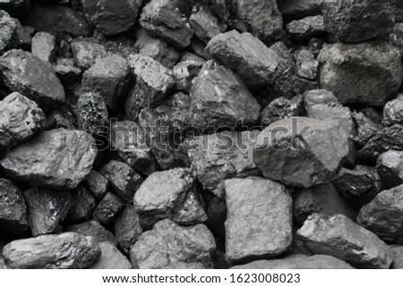Pile of natural black hard coal for texture background. Best grade of metallurgical anthracite coals often referred to as stone coal and black diamond coal Royalty-Free Stock Photo #1623008023
