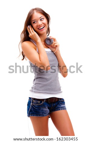 young happy girl wearing headphones over white