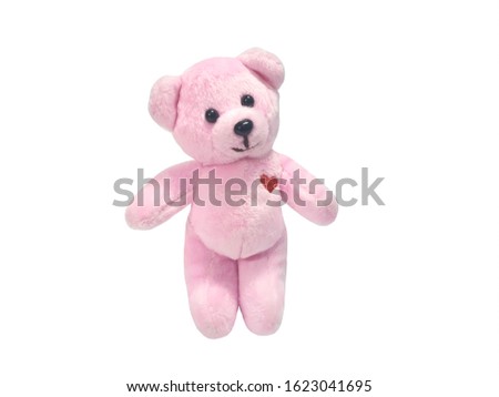 Cute teddy bear  isolated on white background with copy space.Smile of friendship.Pink teddy bear with heart shaped embroidery. gift for valentine day