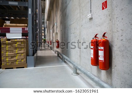 Fire extinguishers in the warehouse. Fire safety Royalty-Free Stock Photo #1623051961