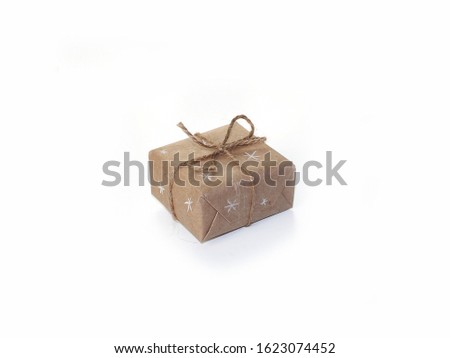 Gift in Kraft paper on a white background