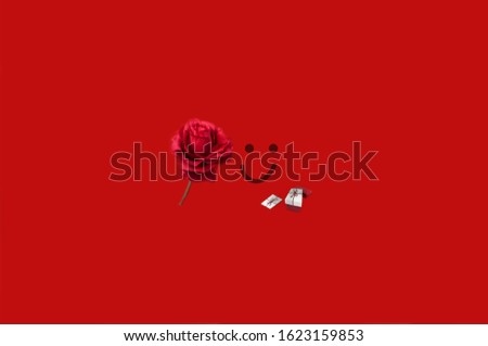  Beautiful red roses with a smiling face and a gift box decorate the idea of ​​Valentine.            