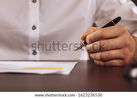 Man lawer working with contract papers. Attorney concept.
