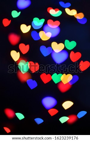 Abstract bokeh hearts on black background. Christmas  and Valentines day
