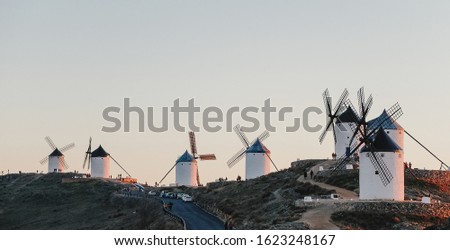 windmills in medieval territory with blue sky