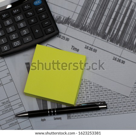 Calculator, sticker and pen isolated on white background