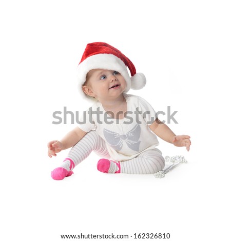 adorable baby girl in Santa hat  with pearl necklace
