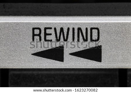 Macro close up view of vintage boombox cassette tape machine rewind button detail. Royalty-Free Stock Photo #1623270082