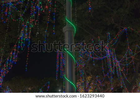 abstract of beautifully decorated lights over lamp post during festival season adds beauty to the frame in low light condition with selective focus Pondy Bazaar tnagar chennai india tamilnadu